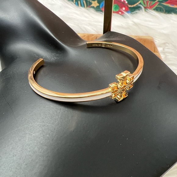 Tory Burch Elegant Gold Cross Bangle with White Enamel Design - Picture 8 of 10
